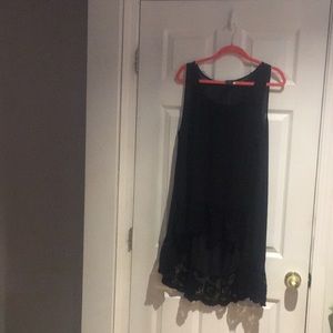 Torrid~Tunic Length sleeveless sheer top.